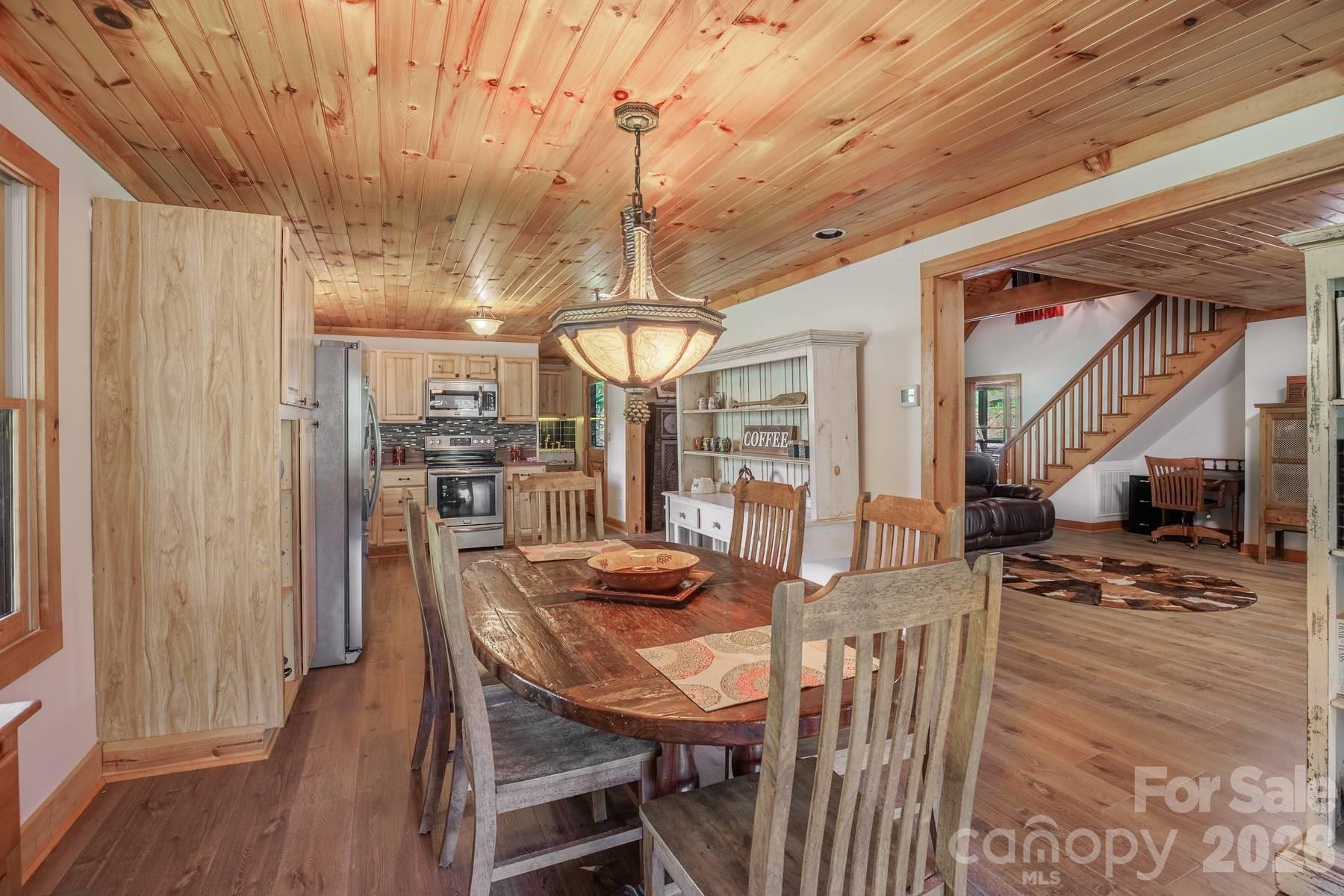 440 Huskey Road Bryson City, NC 28713 - Photo 8 of 42 a dining room with furniture and wooden floor