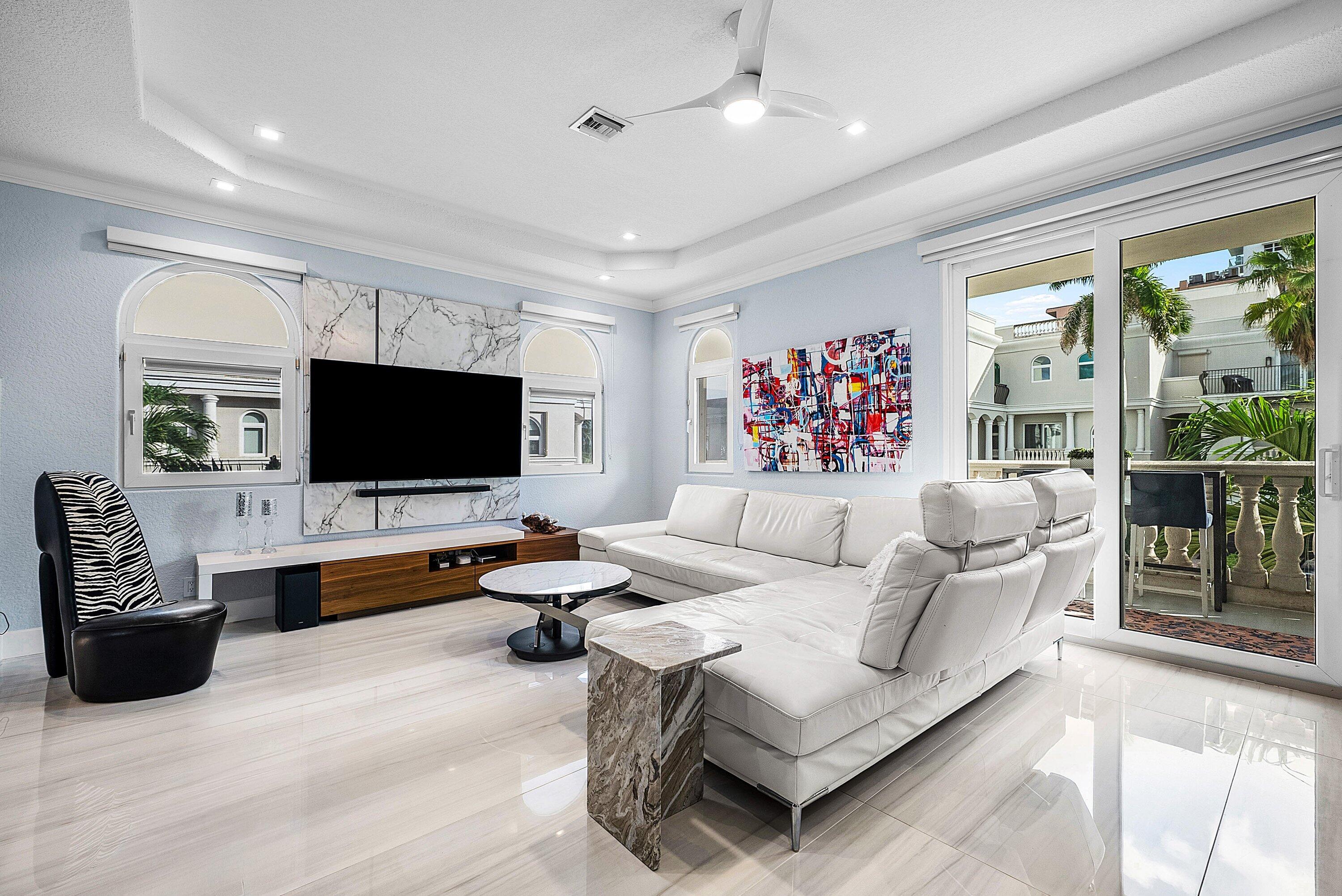 1792 Bay Drive, Unit 27 Pompano Beach, FL 33062 - Photo 11 of 51 a living room with furniture and a flat screen tv