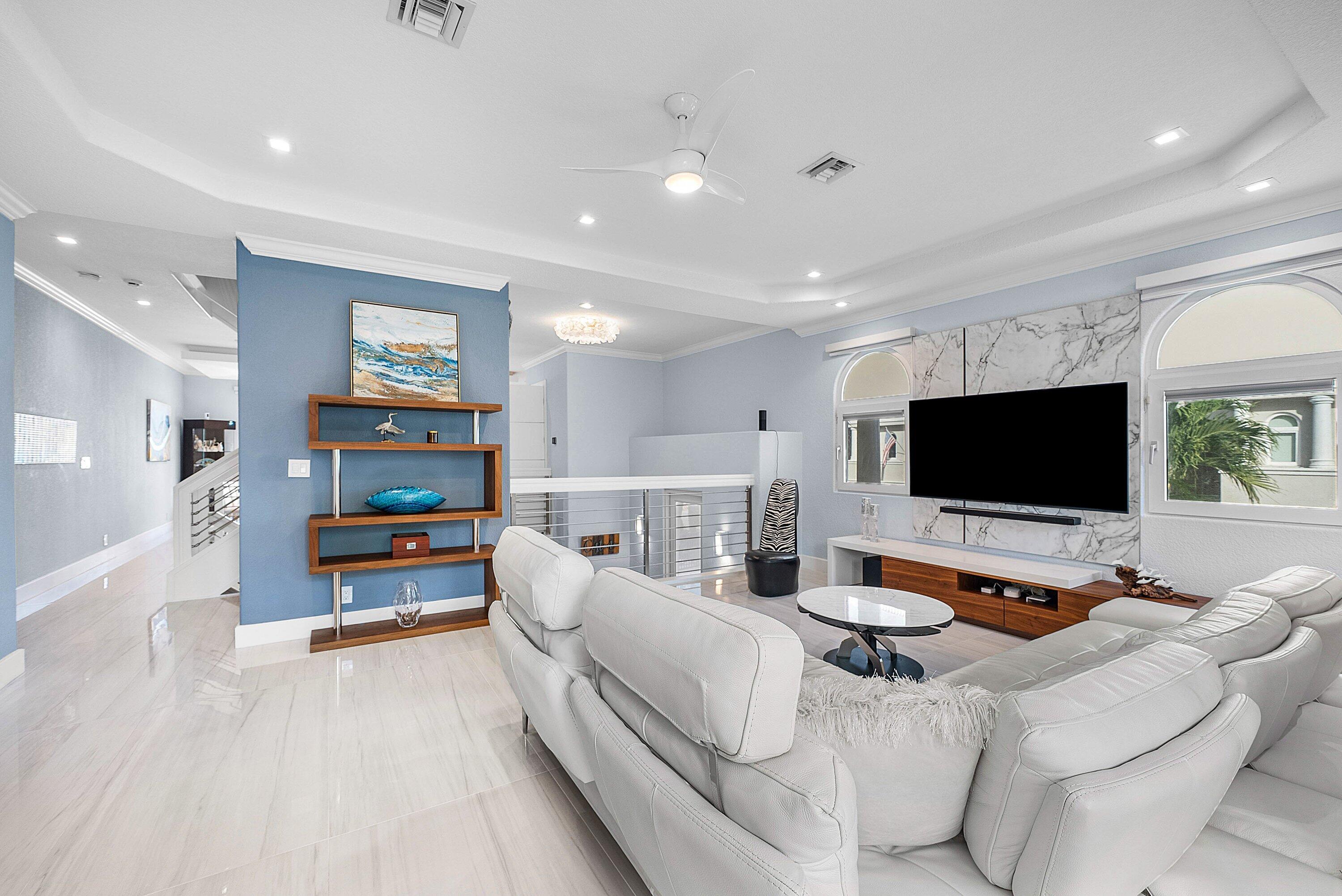 1792 Bay Drive, Unit 27 Pompano Beach, FL 33062 - Photo 12 of 51 a living room with furniture and a flat screen tv