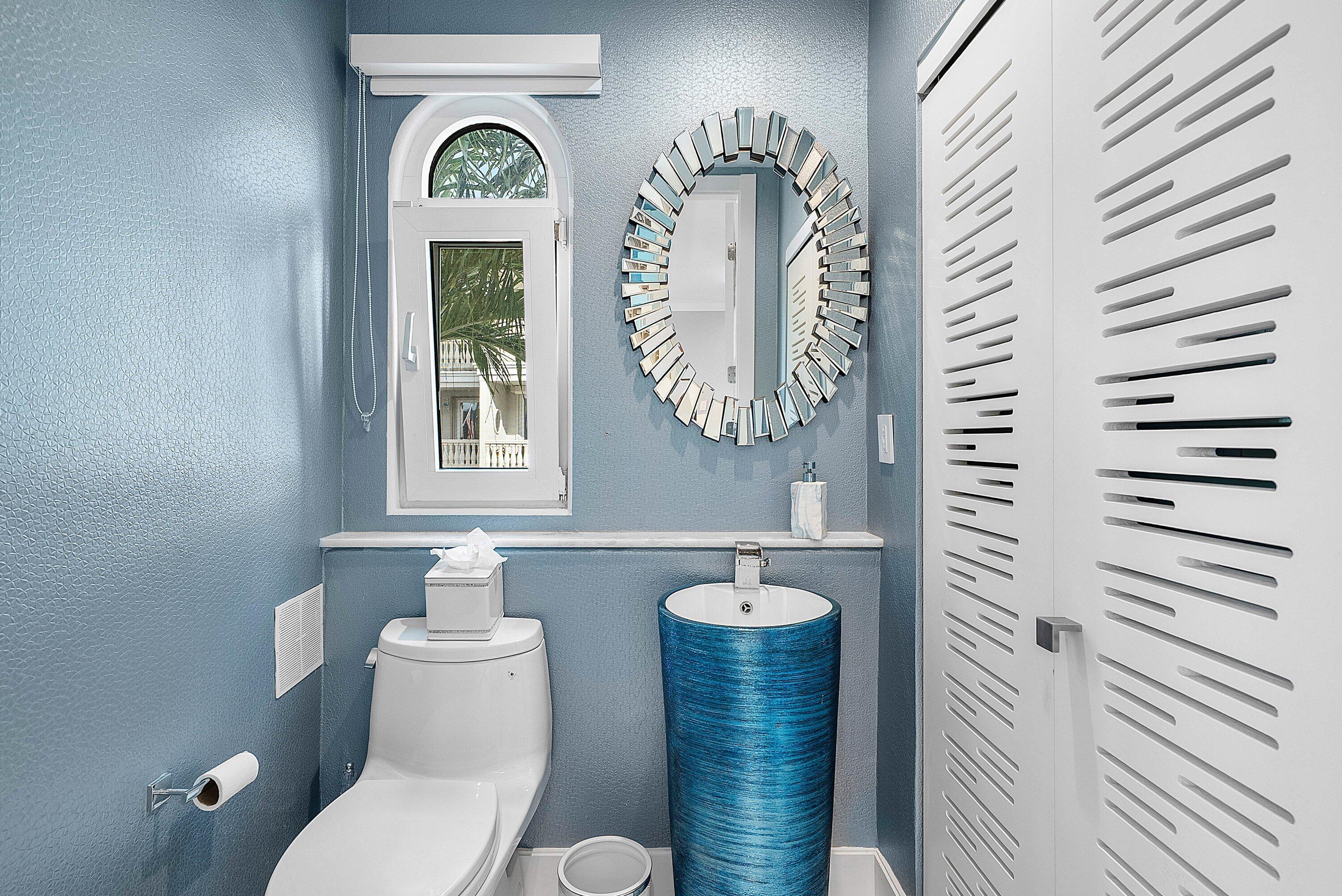 1792 Bay Drive, Unit 27 Pompano Beach, FL 33062 - Photo 14 of 51 a bathroom with a toilet and a sink