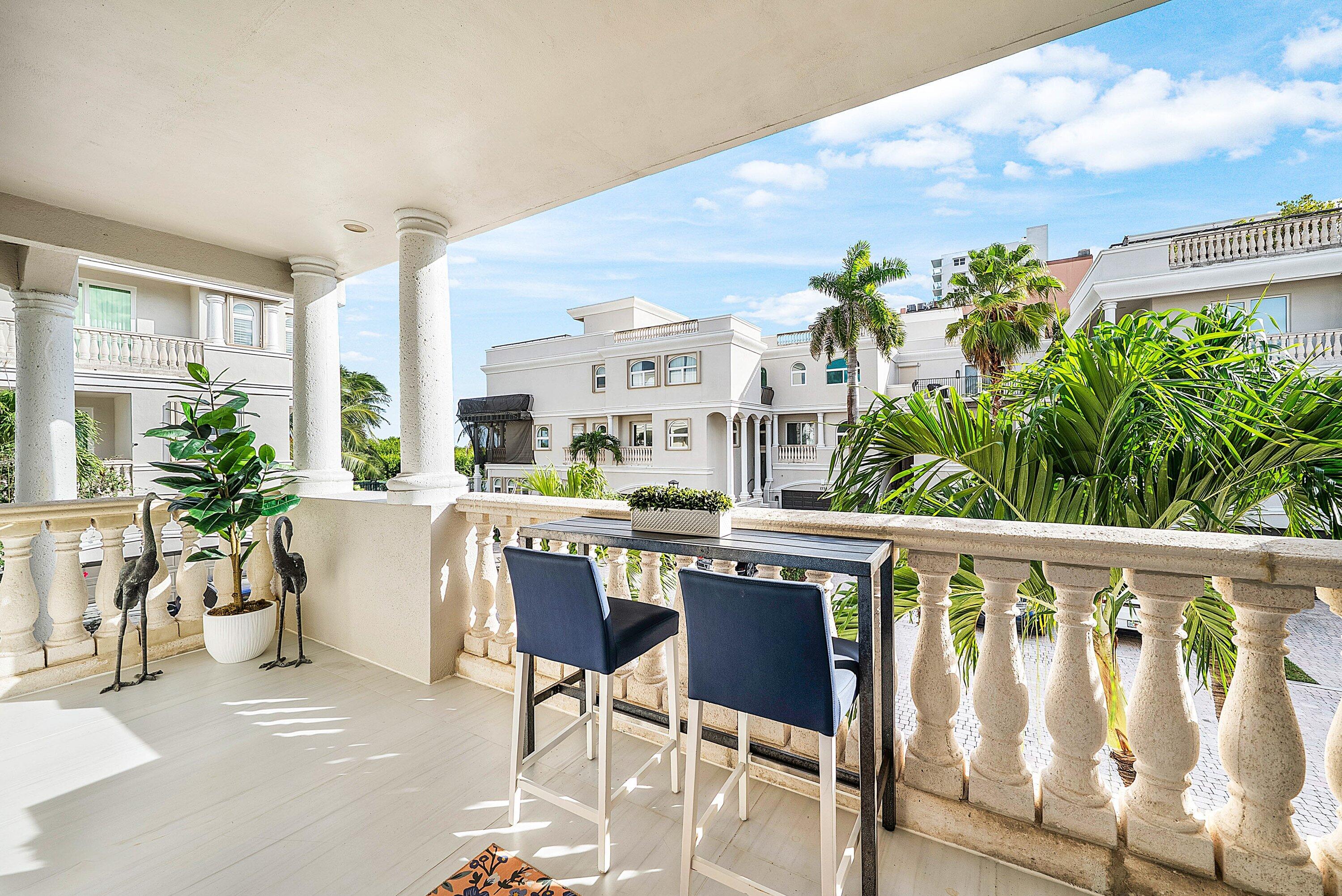 1792 Bay Drive, Unit 27 Pompano Beach, FL 33062 - Photo 15 of 51 a living room with furniture a flower pot and a large window