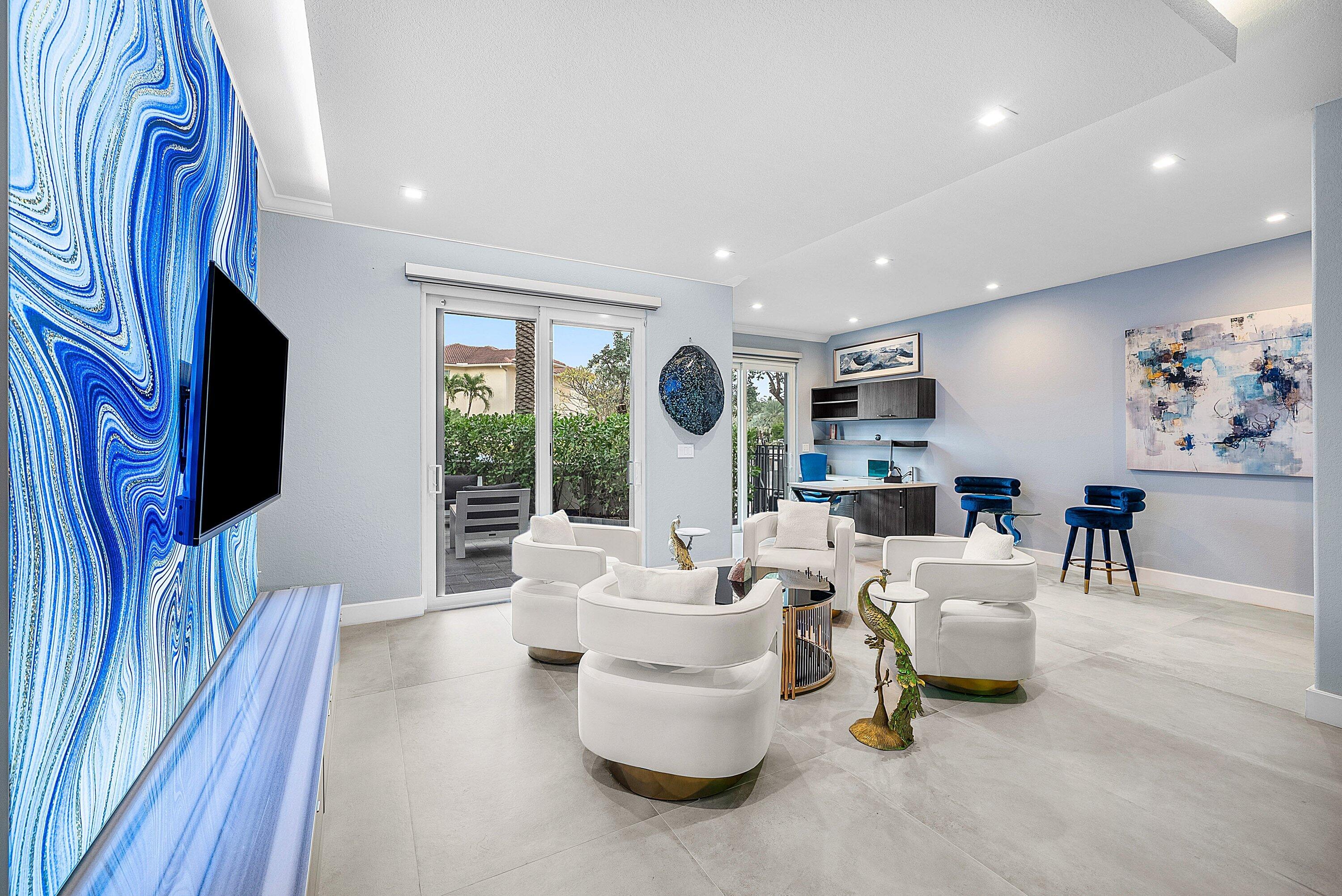 1792 Bay Drive, Unit 27 Pompano Beach, FL 33062 - Photo 17 of 51 a living room with furniture and a flat screen tv