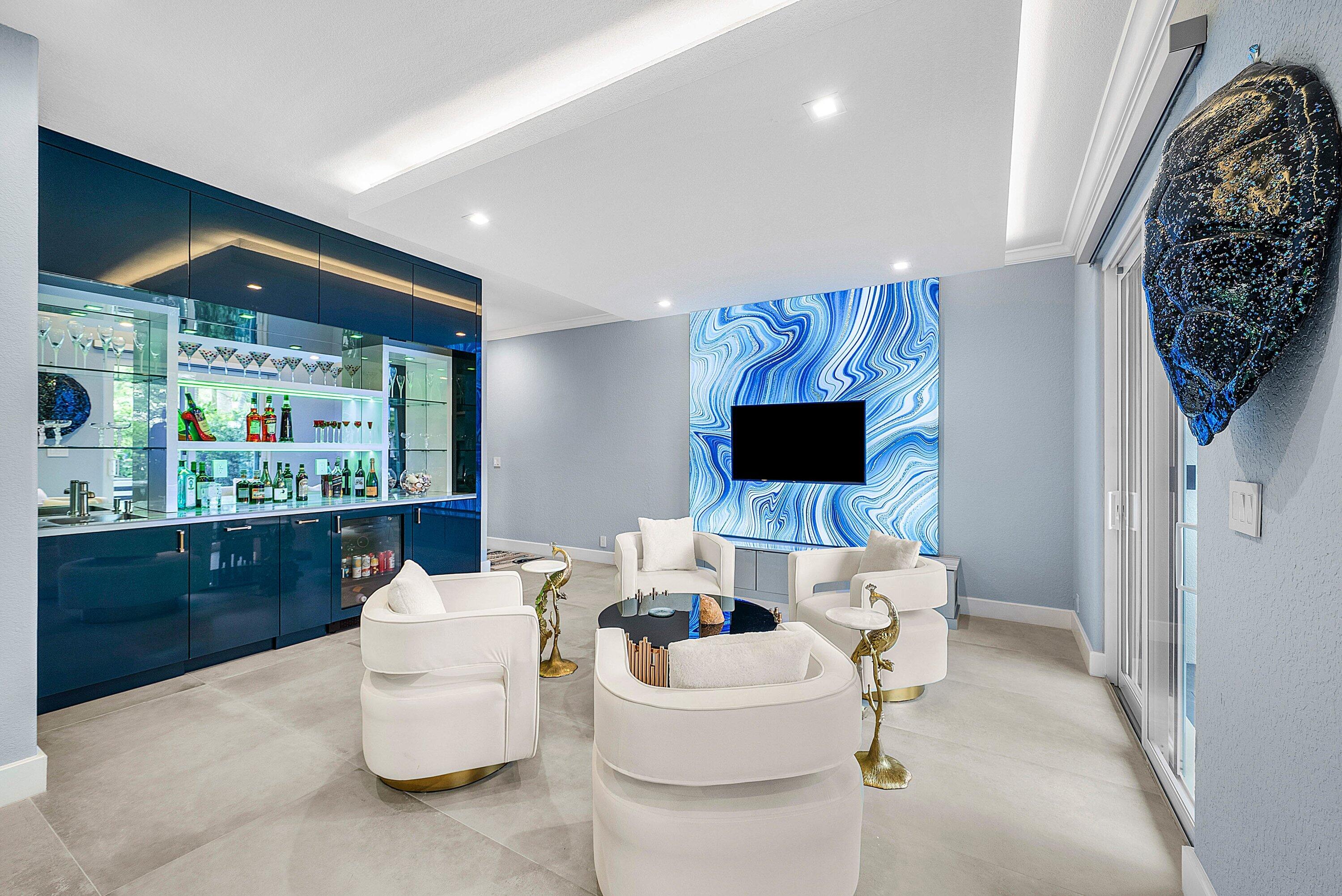 1792 Bay Drive, Unit 27 Pompano Beach, FL 33062 - Photo 18 of 51 a living room with furniture and a flat screen tv