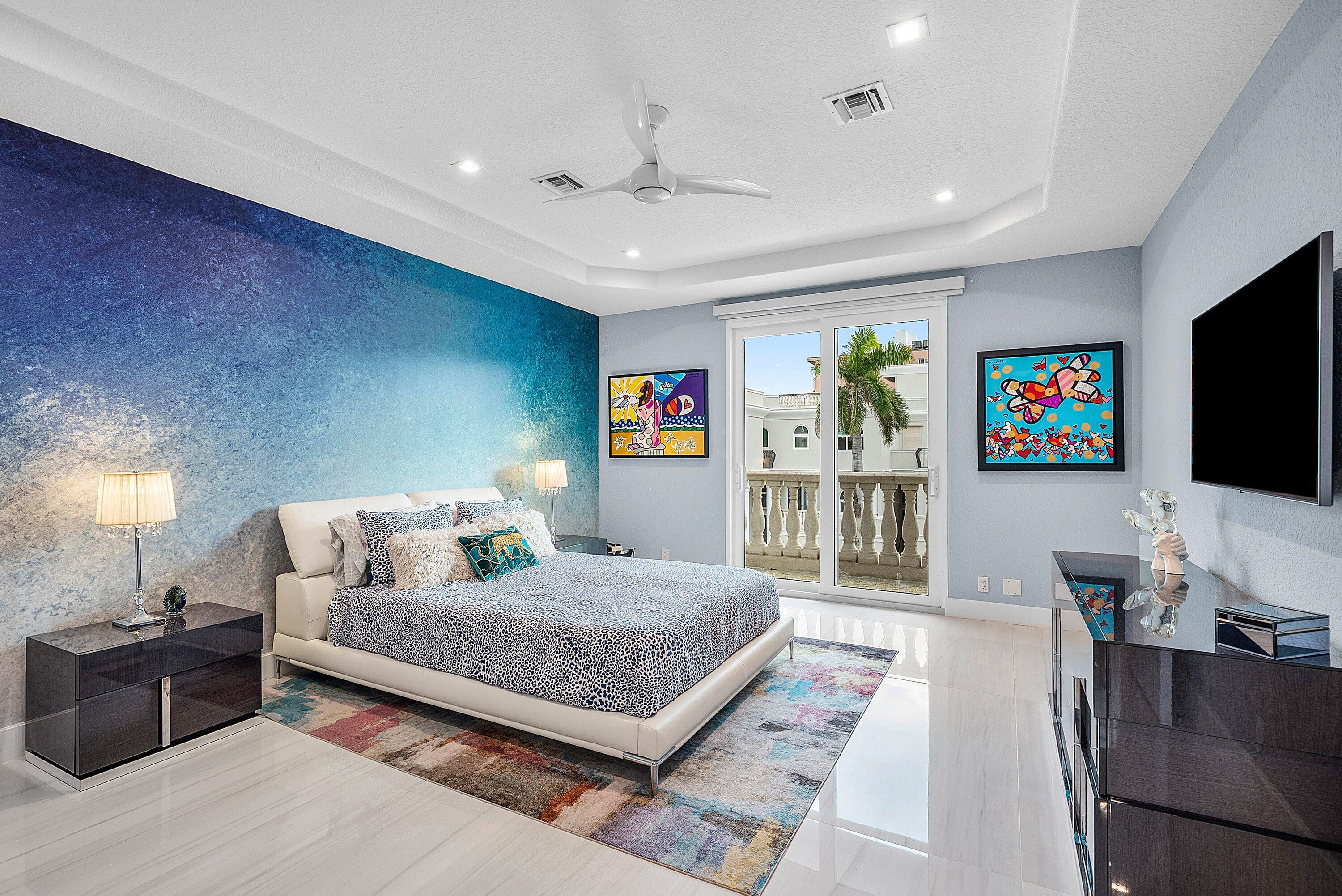 1792 Bay Drive, Unit 27 Pompano Beach, FL 33062 - Photo 22 of 51 a bedroom with a bed and flat screen tv