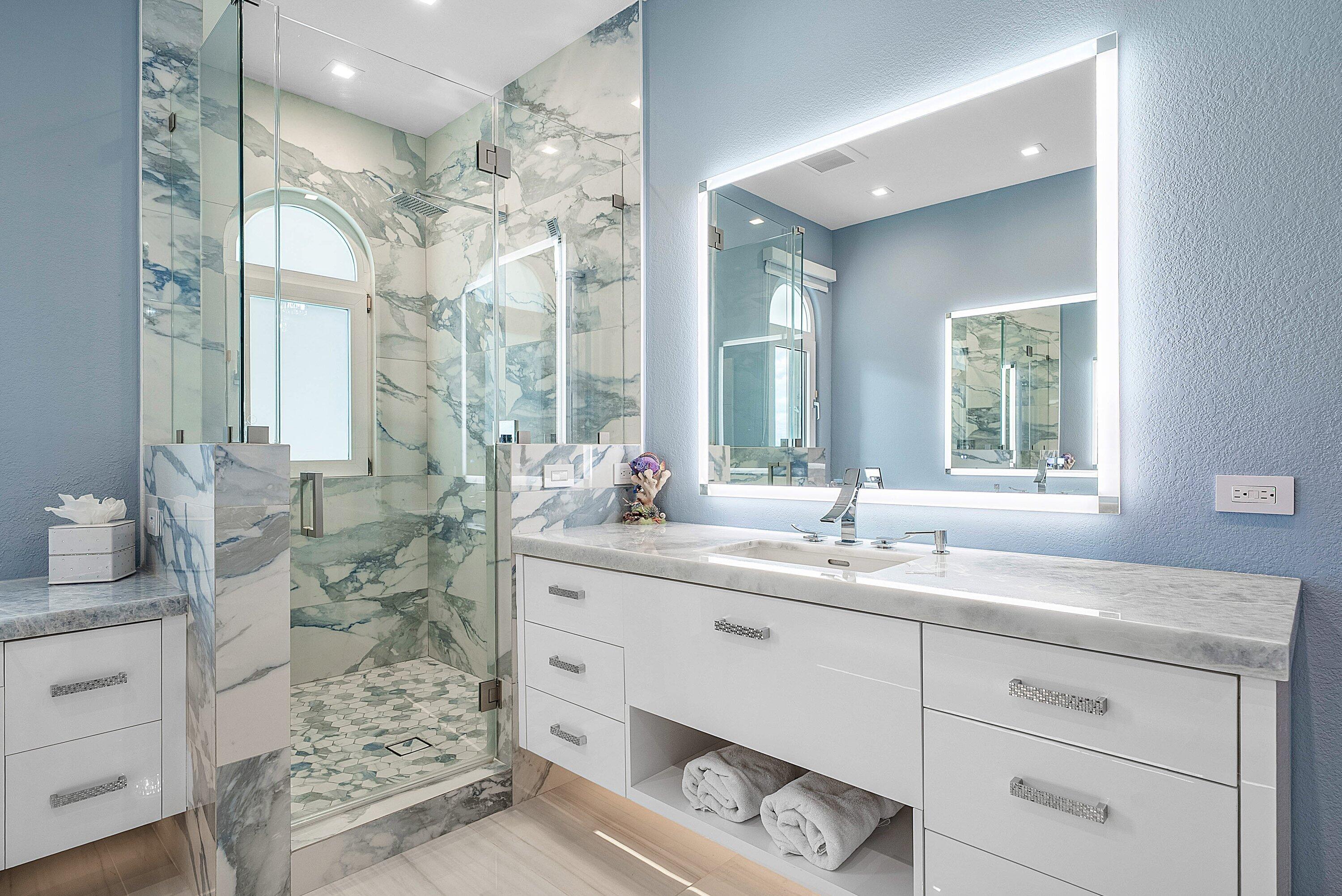 1792 Bay Drive, Unit 27 Pompano Beach, FL 33062 - Photo 26 of 51 a bathroom with double sink and a mirror