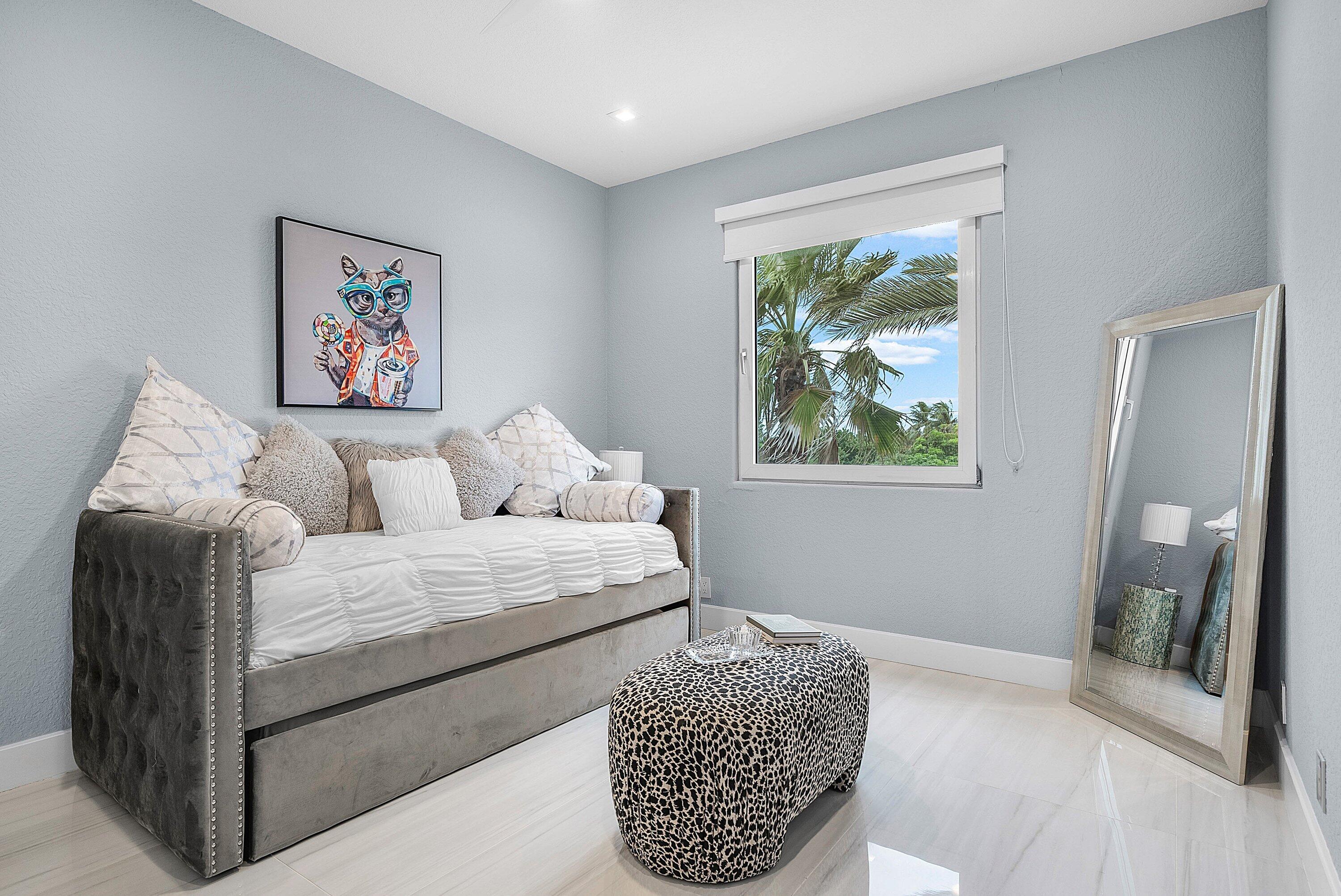 1792 Bay Drive, Unit 27 Pompano Beach, FL 33062 - Photo 32 of 51 a bedroom with furniture and a window