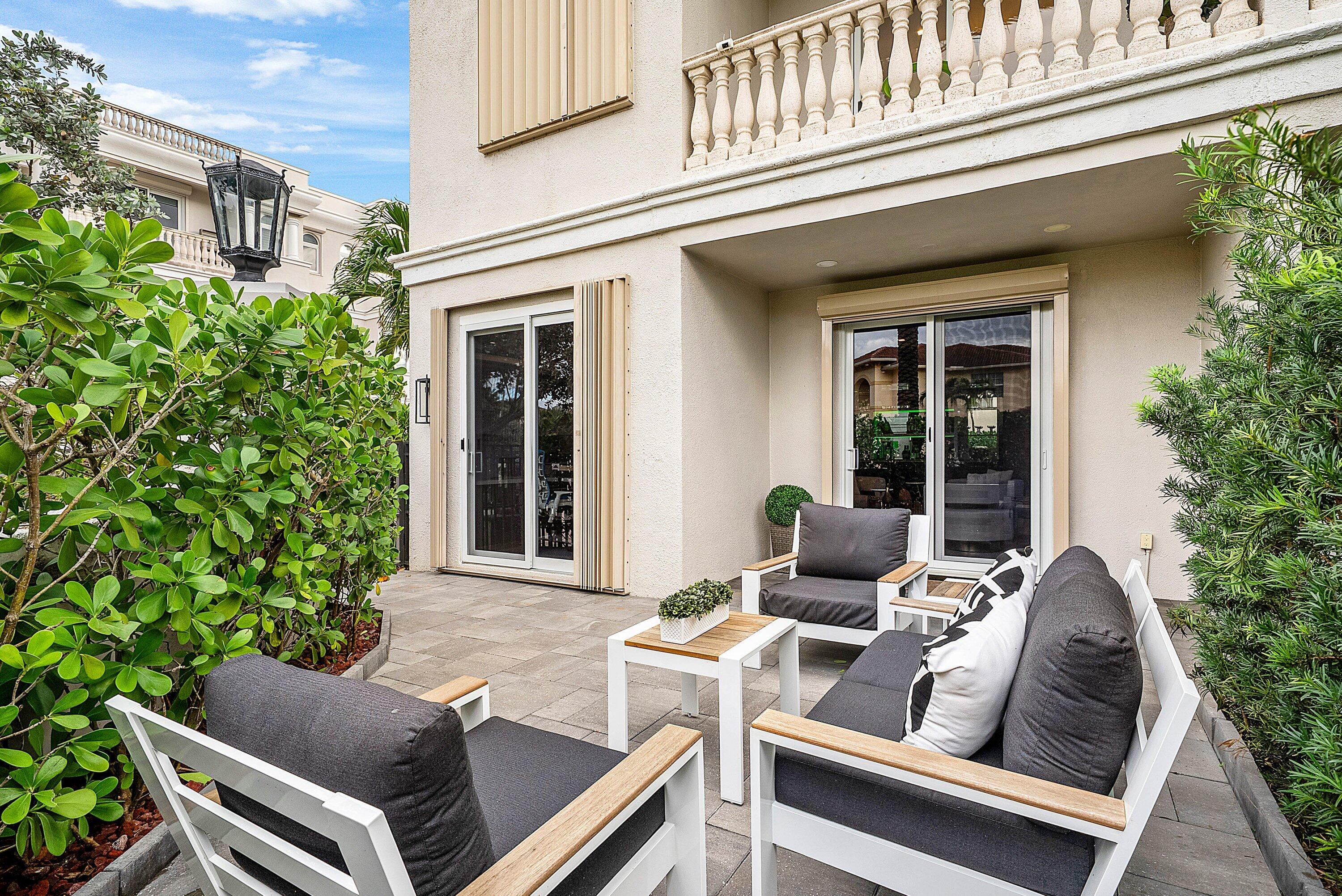 1792 Bay Drive, Unit 27 Pompano Beach, FL 33062 - Photo 36 of 51 a view of a patio with couple of chairs and a potted plant