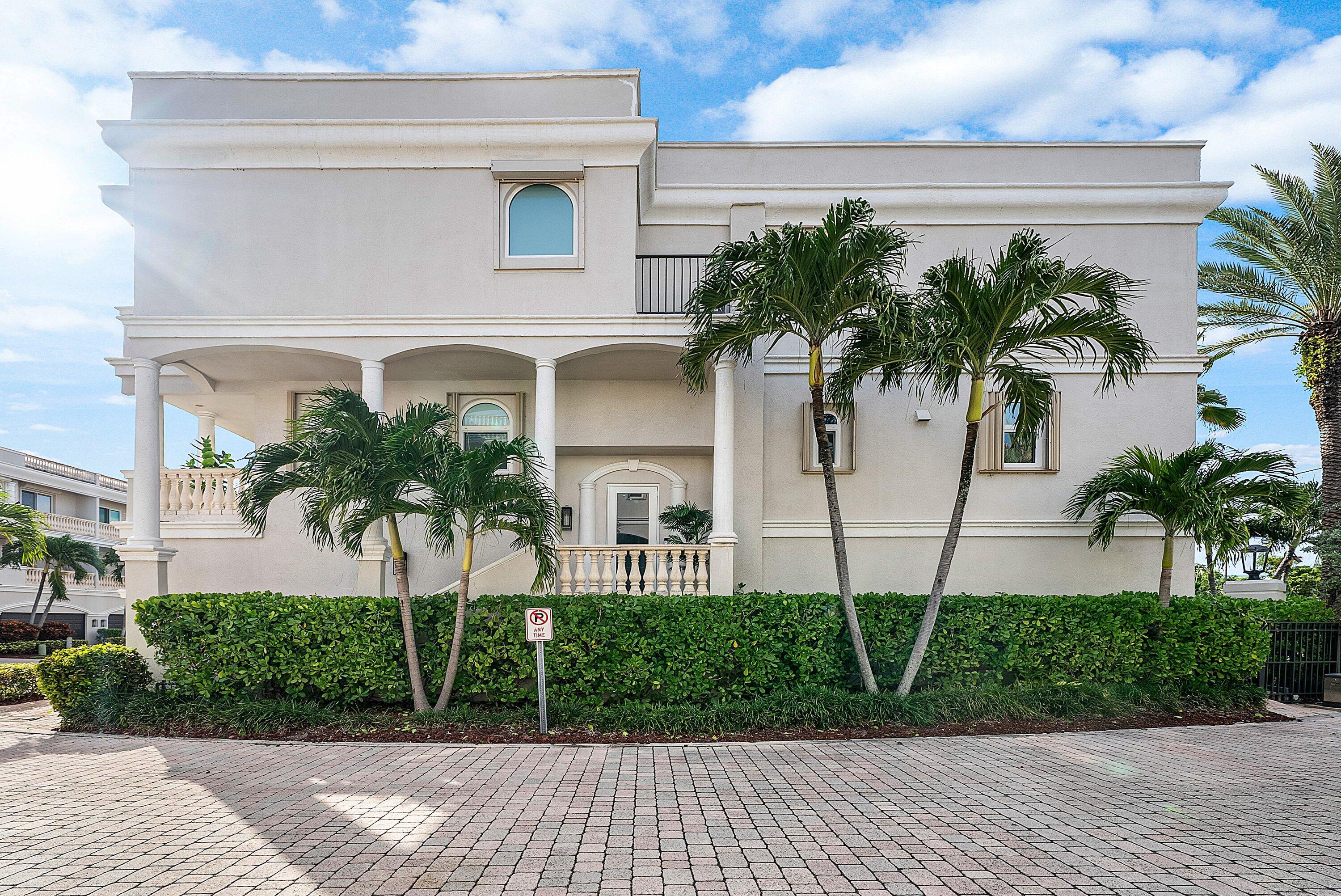 1792 Bay Drive, Unit 27 Pompano Beach, FL 33062 - Photo 37 of 51 a front view of a house with a yard and potted plants