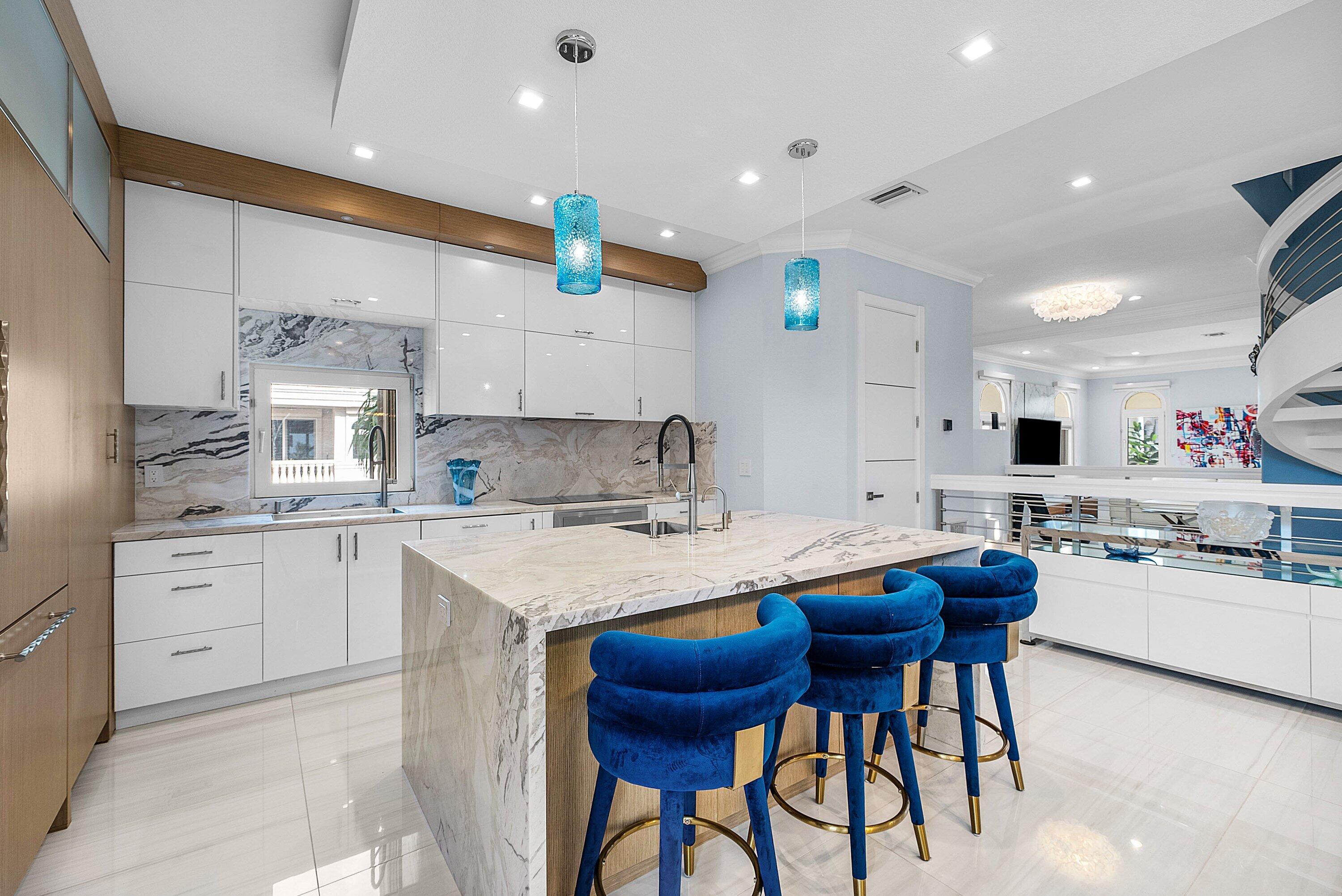 1792 Bay Drive, Unit 27 Pompano Beach, FL 33062 - Photo 4 of 51 a kitchen with stainless steel appliances kitchen island granite countertop a sink and cabinets