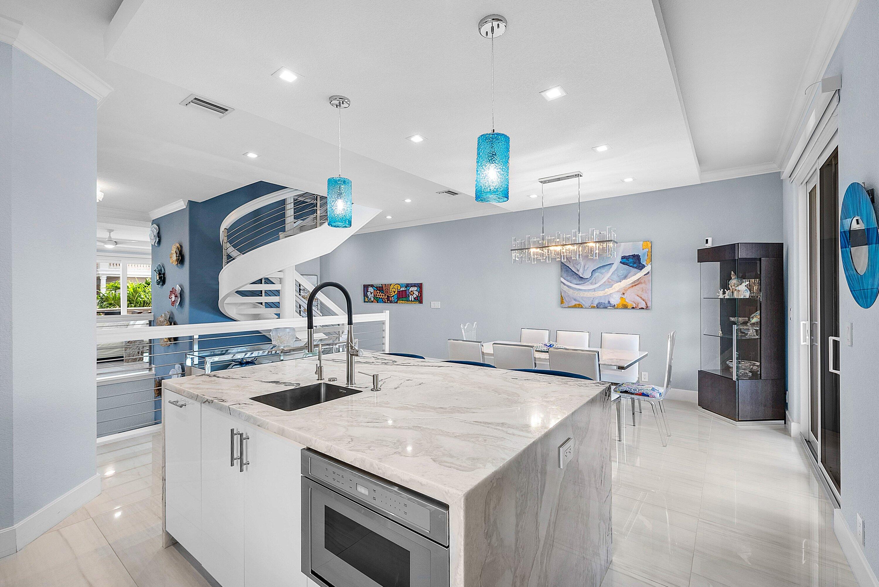 1792 Bay Drive, Unit 27 Pompano Beach, FL 33062 - Photo 6 of 51 a kitchen with a sink a stove and refrigerator