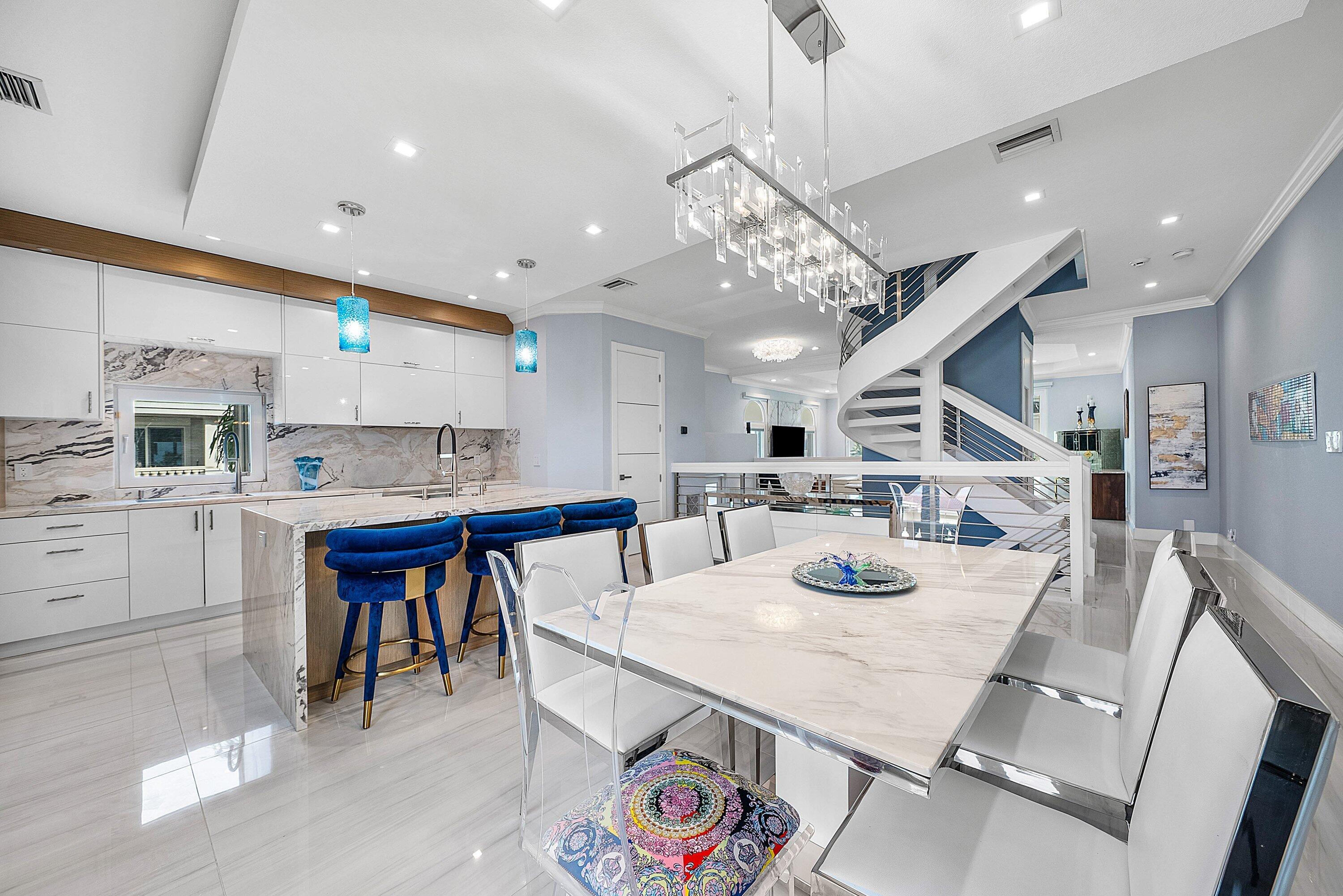 1792 Bay Drive, Unit 27 Pompano Beach, FL 33062 - Photo 7 of 51 a view of a dining area with furniture and a chandelier