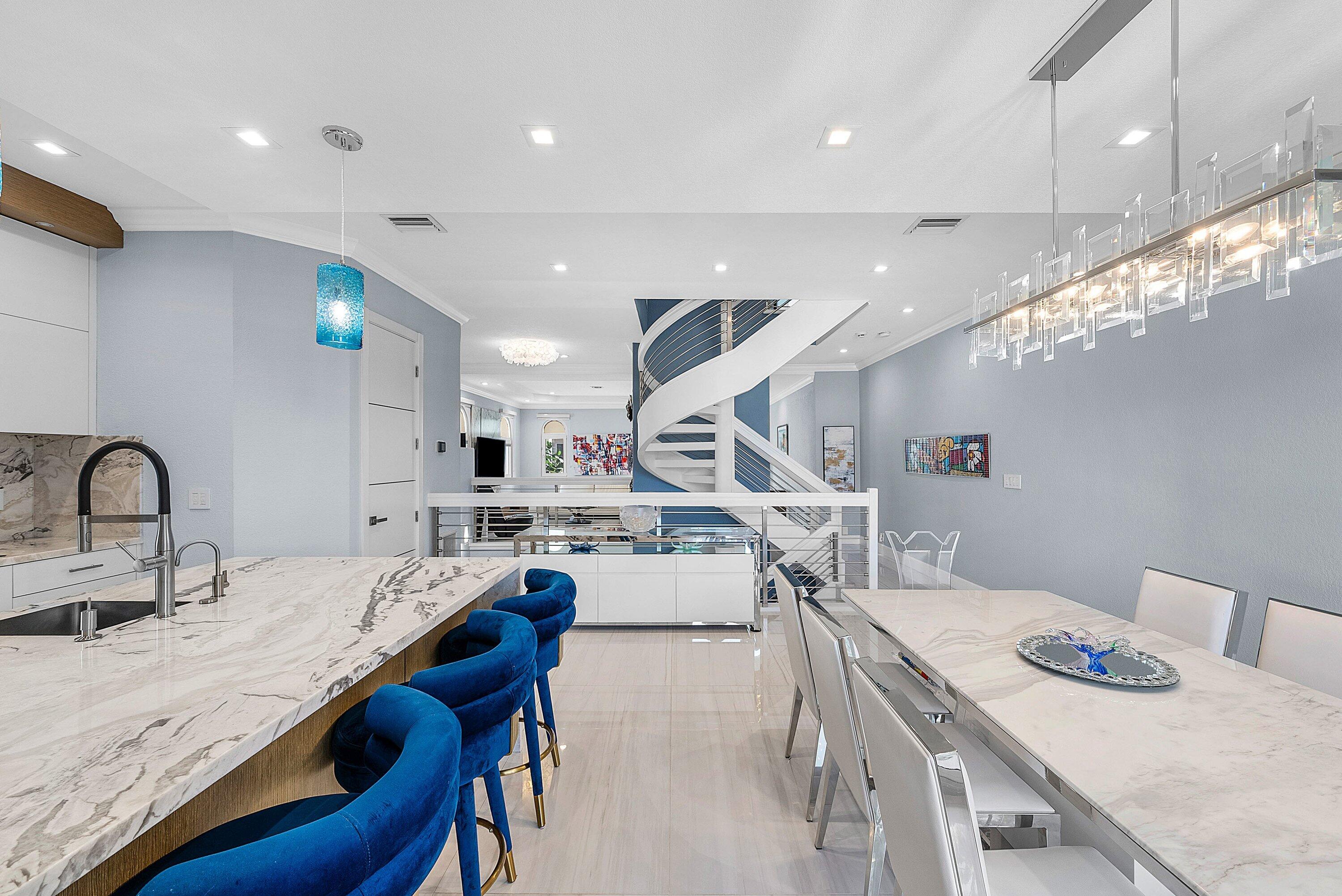 1792 Bay Drive, Unit 27 Pompano Beach, FL 33062 - Photo 8 of 51 a kitchen with stainless steel appliances kitchen island granite countertop a sink and wooden cabinets