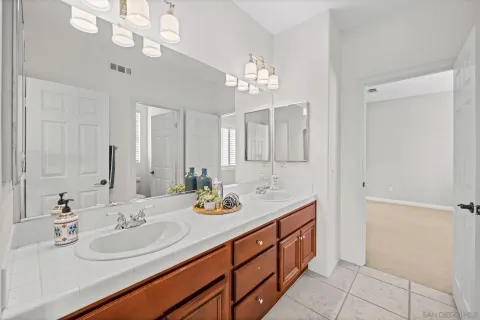 a bathroom with a sink a vanity and a mirror