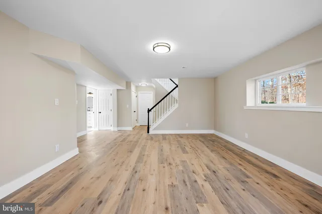 a room with window and pool table