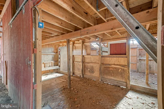 a brick building with a bench in front of it