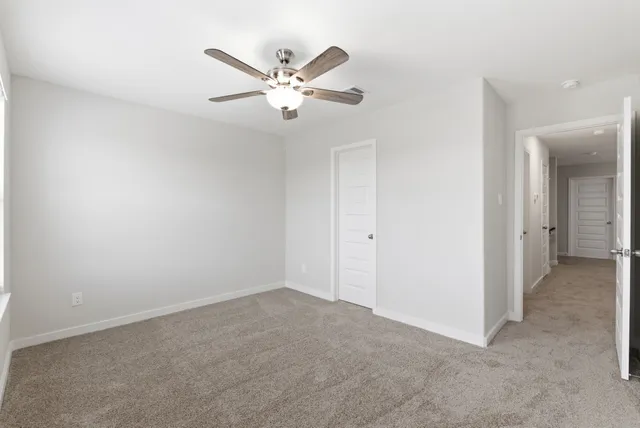 a view of a room with a fan