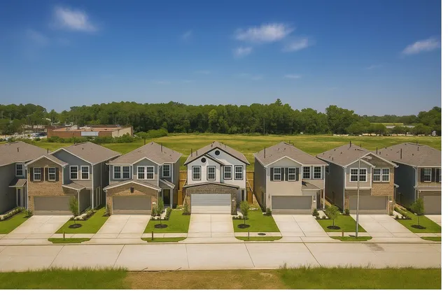 a view of houses with city street and green space