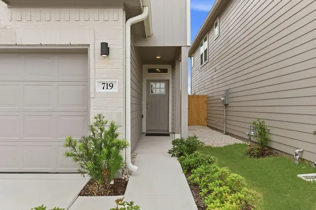a side view of a house with a yard