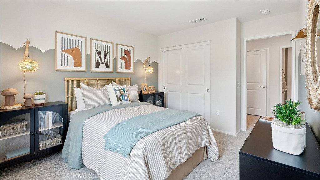11392 Forge Road Corona, CA 92883 - Photo 21 of 24 a bedroom with a bed and a potted plant