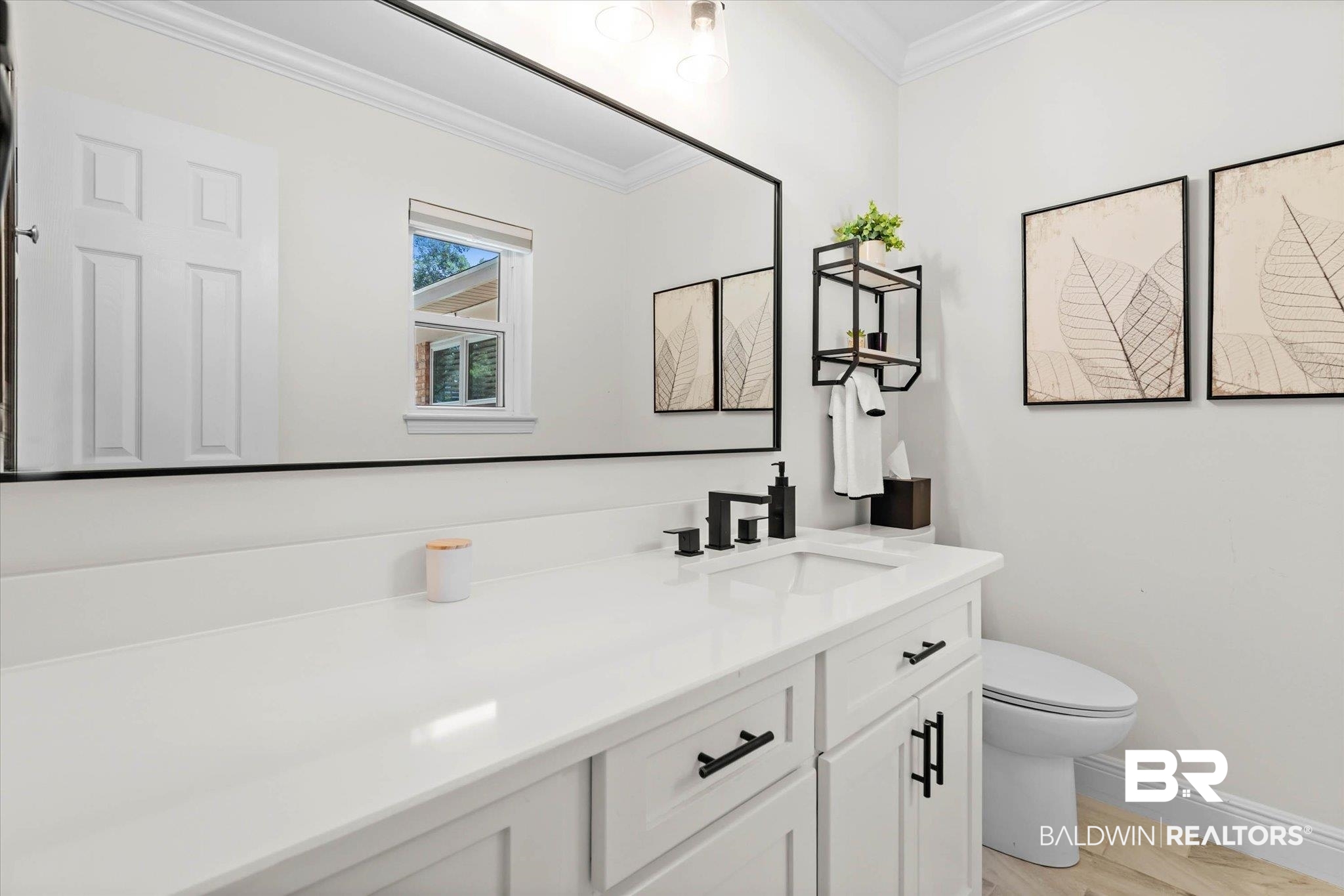 101 Ann Street Daphne, AL 36527 - Photo 17 of 38 Spacious vanity with a white countertop and undermount sink, complemented by matte black hardware