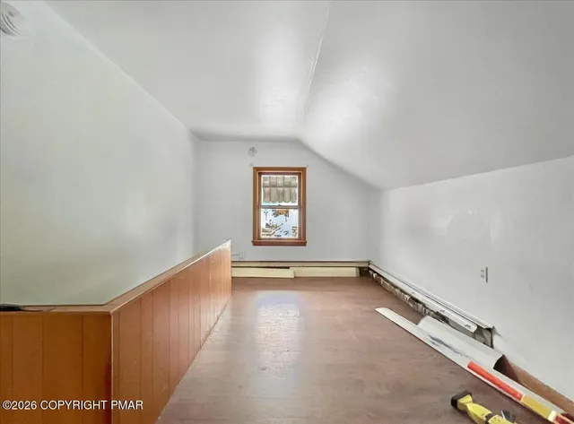 a view of a house with wooden deck