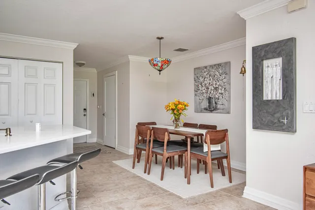 a dining room with furniture and window