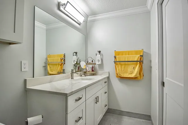 a bathroom with a sink and a mirror