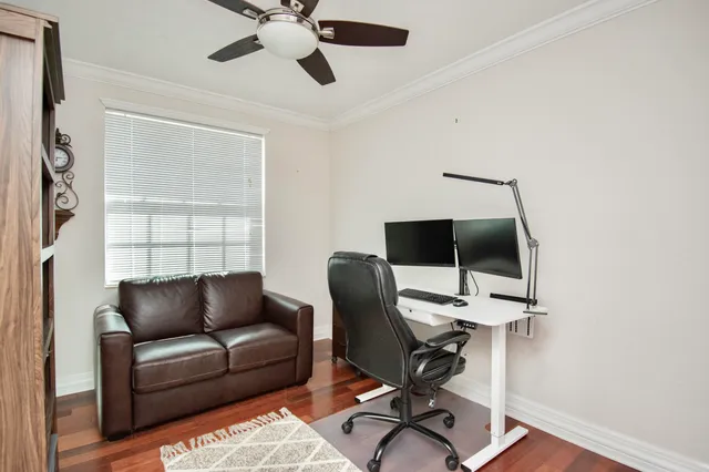 a work room with furniture and a window