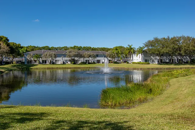a view of a lake with houses in the back