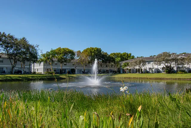 a view of a swimming pool with a lake view
