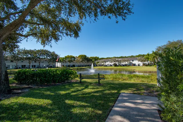 a view of lake with a yard