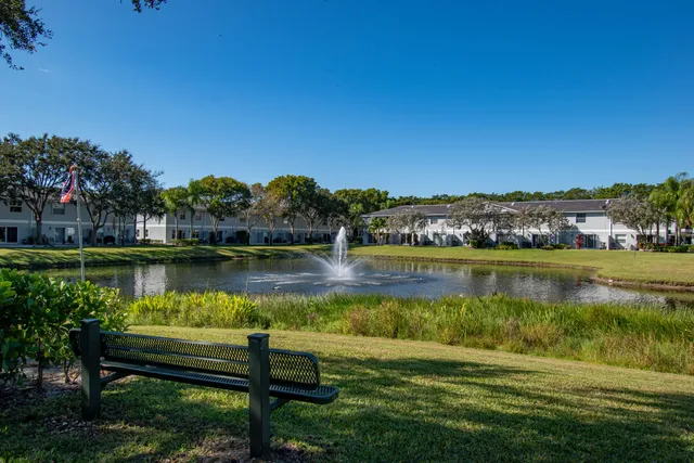 a view of a lake with houses in the background