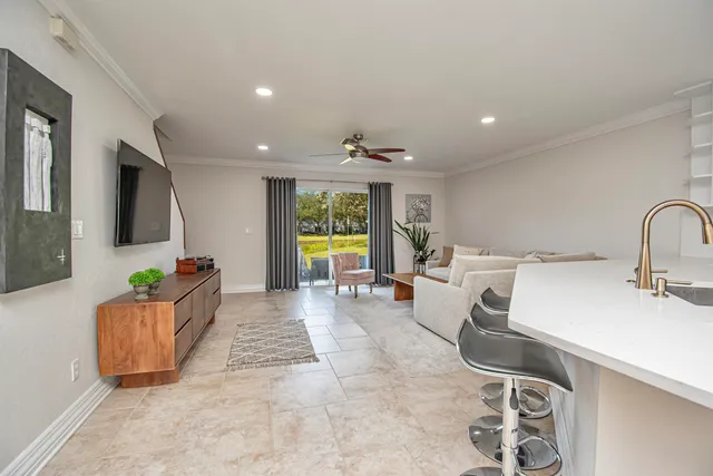a living room with furniture and a table
