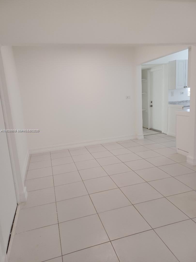 2149 Northeast 179th Street North Miami Beach, FL 33162 - Photo 8 of 15 DINING AREA OFF THE KITCHEN AND THE LIVING ROOM