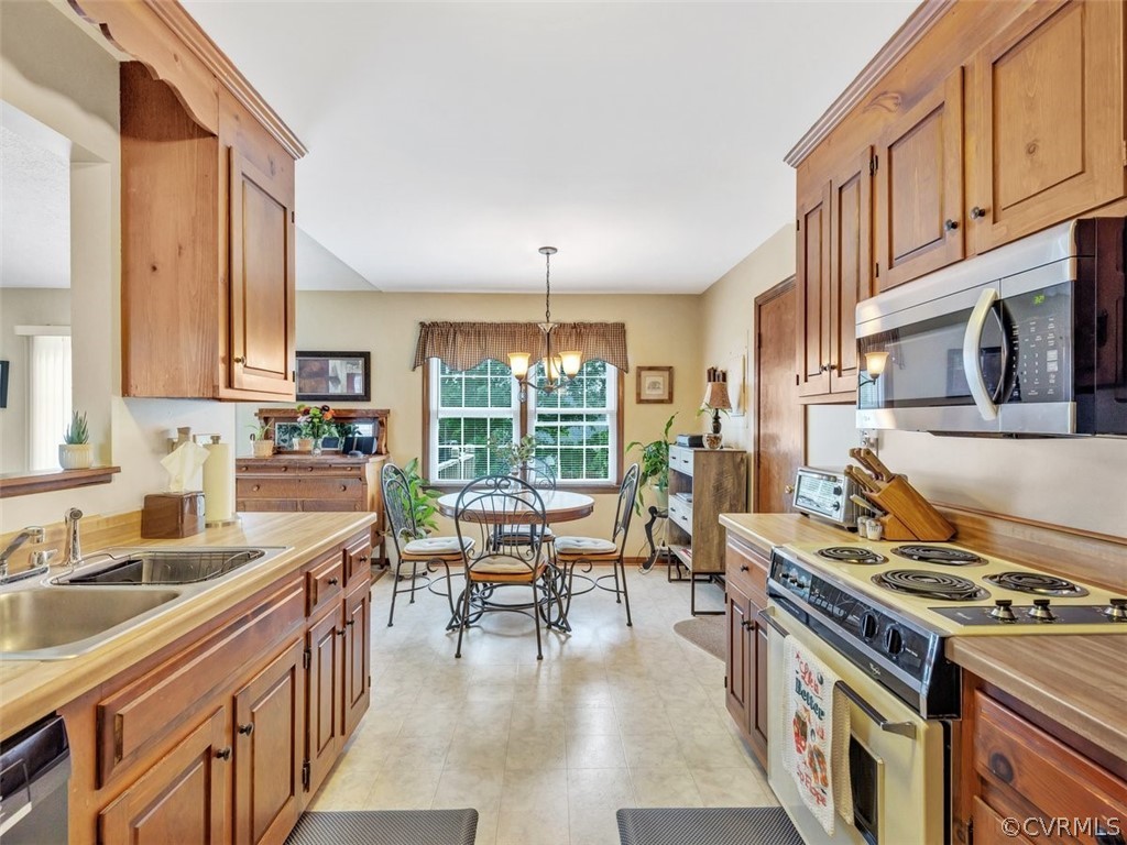 7713 Drexelbrook Road Chesterfield, VA 23832 - Photo 13 of 22 a kitchen with stove and cabinets