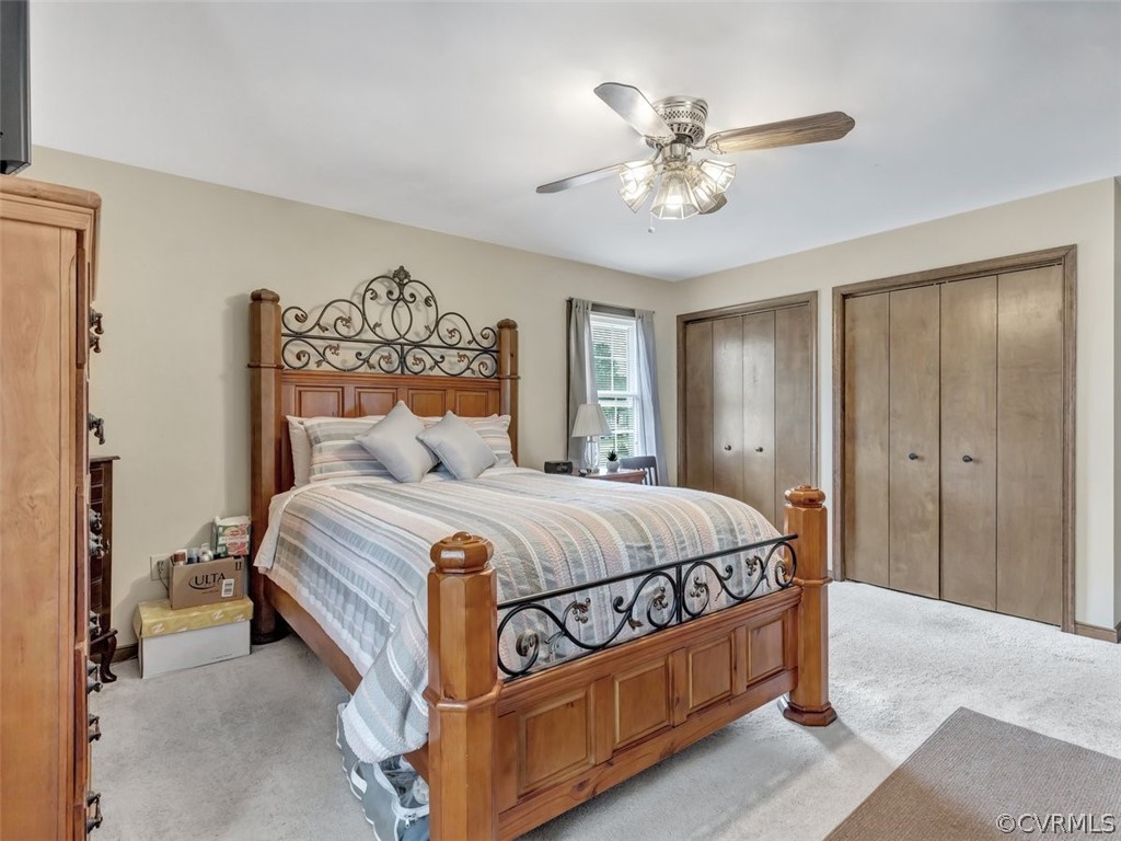 7713 Drexelbrook Road Chesterfield, VA 23832 - Photo 16 of 22 a bedroom with a bed and a chandelier