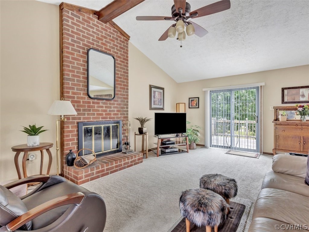 7713 Drexelbrook Road Chesterfield, VA 23832 - Photo 5 of 22 a living room with furniture a fireplace and a flat screen tv