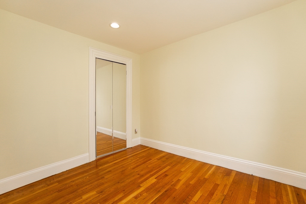 41 Worcester Square, Unit 5 Boston, MA 02118 - Photo 13 of 17 a view of an empty room with wooden floor