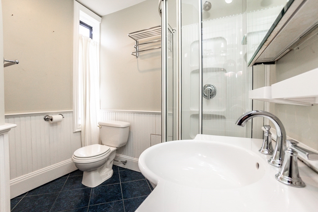 41 Worcester Square, Unit 5 Boston, MA 02118 - Photo 16 of 17 a bathroom with a sink toilet and shower