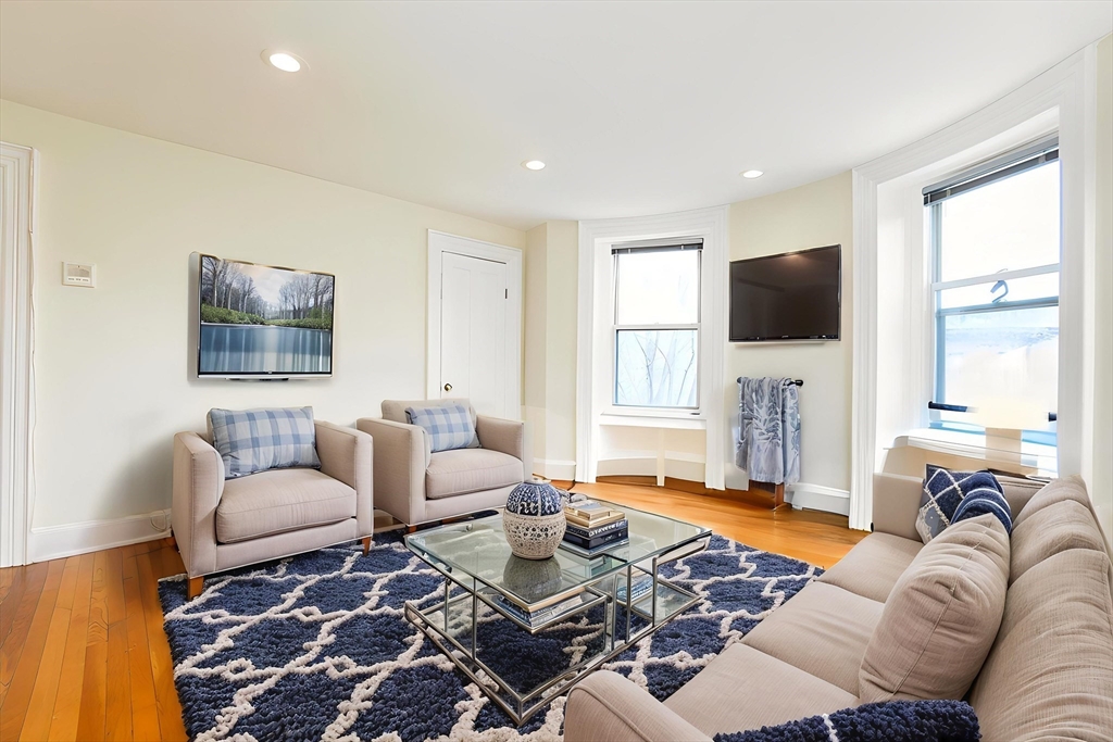 41 Worcester Square, Unit 5 Boston, MA 02118 - Photo 2 of 17 a living room with furniture and a flat screen tv