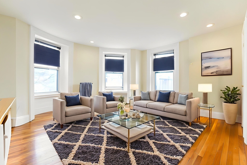 41 Worcester Square, Unit 5 Boston, MA 02118 - Photo 3 of 17 a living room with furniture and wooden floor