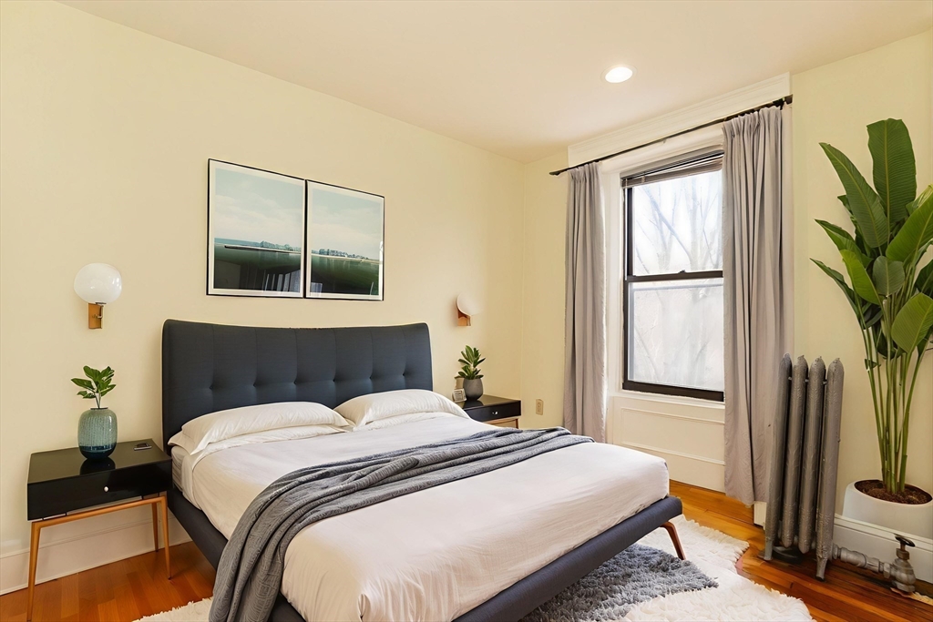 41 Worcester Square, Unit 5 Boston, MA 02118 - Photo 4 of 17 a bedroom with a bed and a flat screen tv