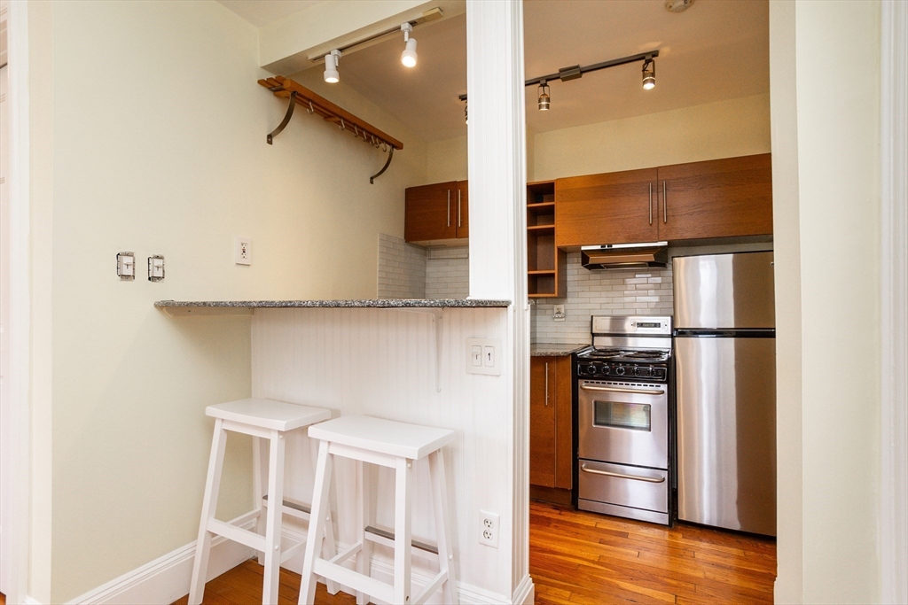 41 Worcester Square, Unit 5 Boston, MA 02118 - Photo 6 of 17 a kitchen with stainless steel appliances a refrigerator and stove