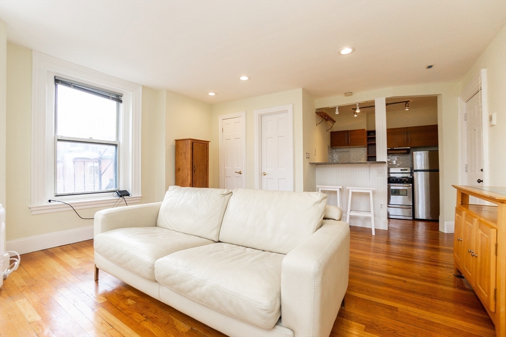41 Worcester Square, Unit 5 Boston, MA 02118 - Photo 7 of 17 a living room with furniture and a wooden floor
