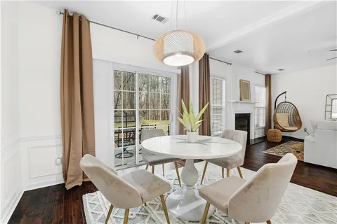 a view of a dining room with furniture window and wooden floor