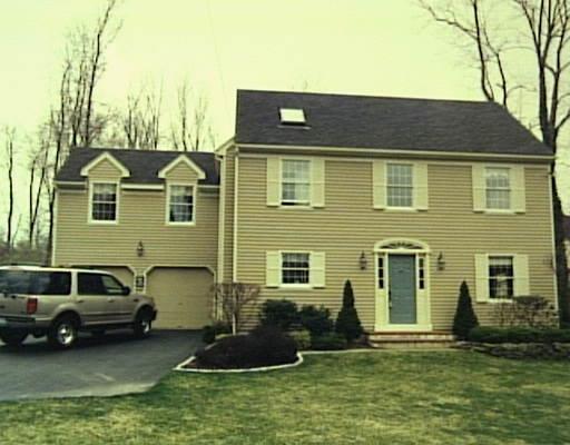 12 Crane Road North Stamford, CT 06902 - Photo 1 of 1 a front view of a house with a yard