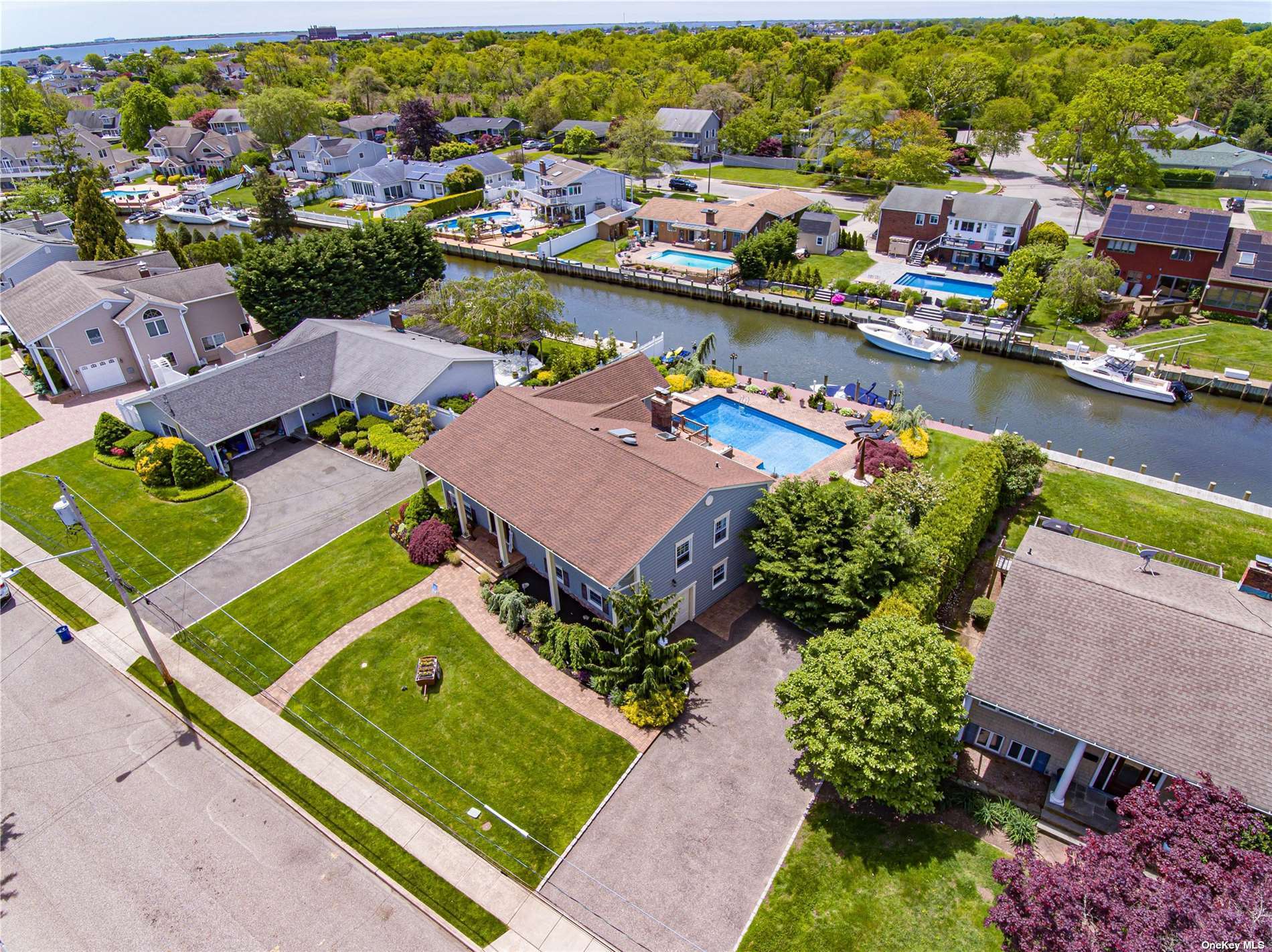 an aerial view of a house with a lake view