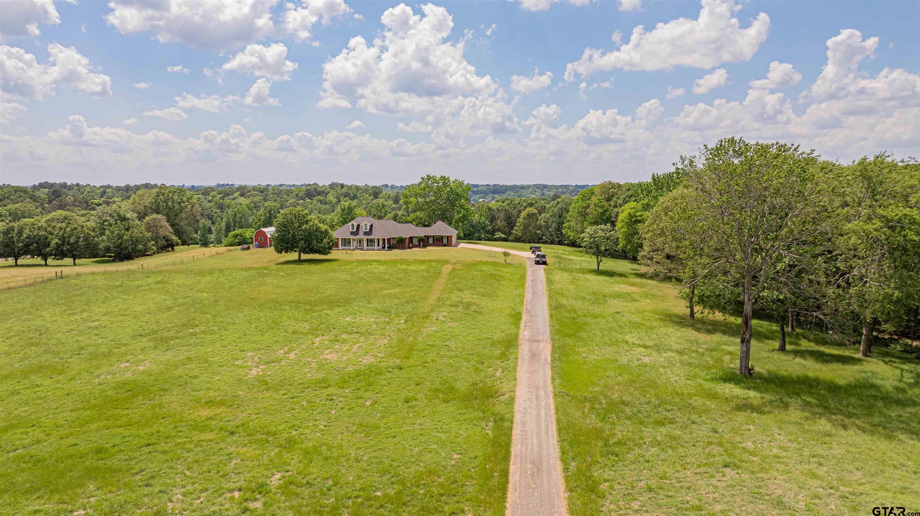 1855 Phillips Springs Road Gladewater, TX 75647 - Photo 22 of 36 a view of yard with swimming pool and green space