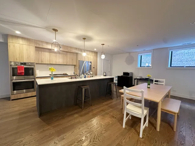 a kitchen with a table and chairs in it