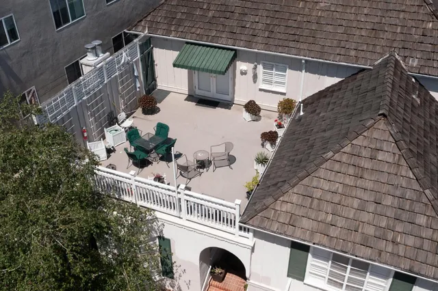 an aerial view of multiple houses with outdoor space